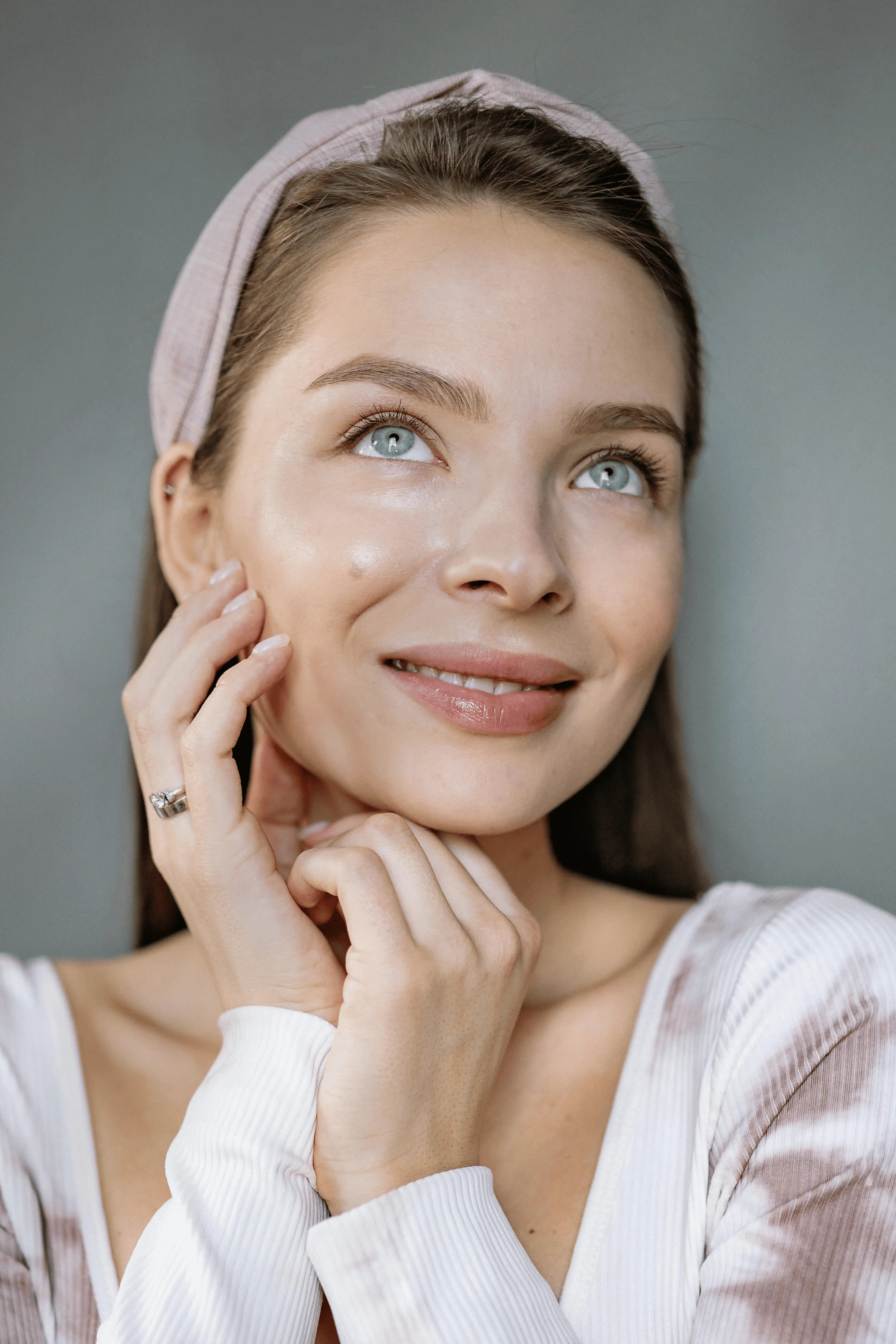 Woman with radiant skin after expert skin treatment at Opulence Skin & Brows clinic in Bentleigh East Melbourne